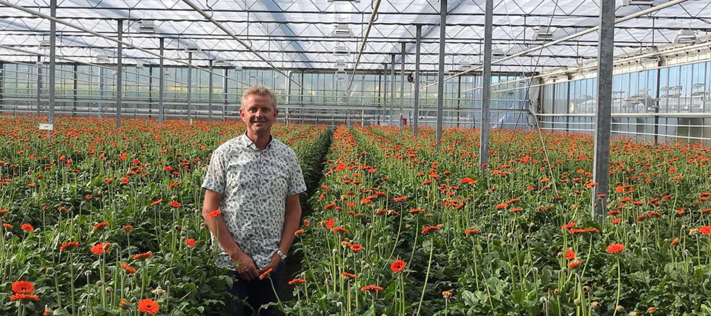 Marco de Groot standing in a greenhouse